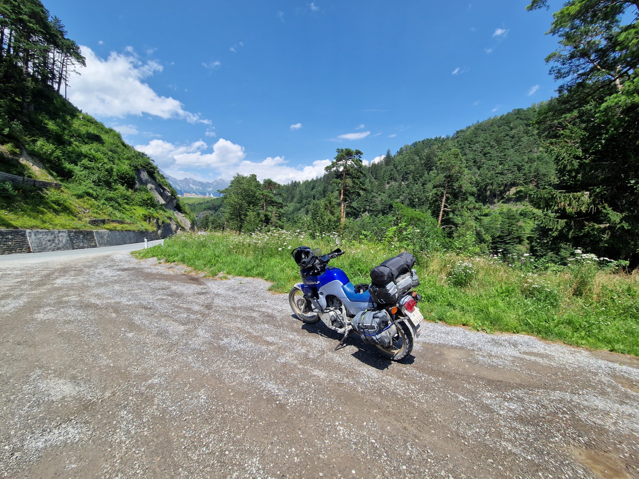 Ride on a Budget Motorcycle parked in Europe on a budget touring trip — budget motorcycle travel europe