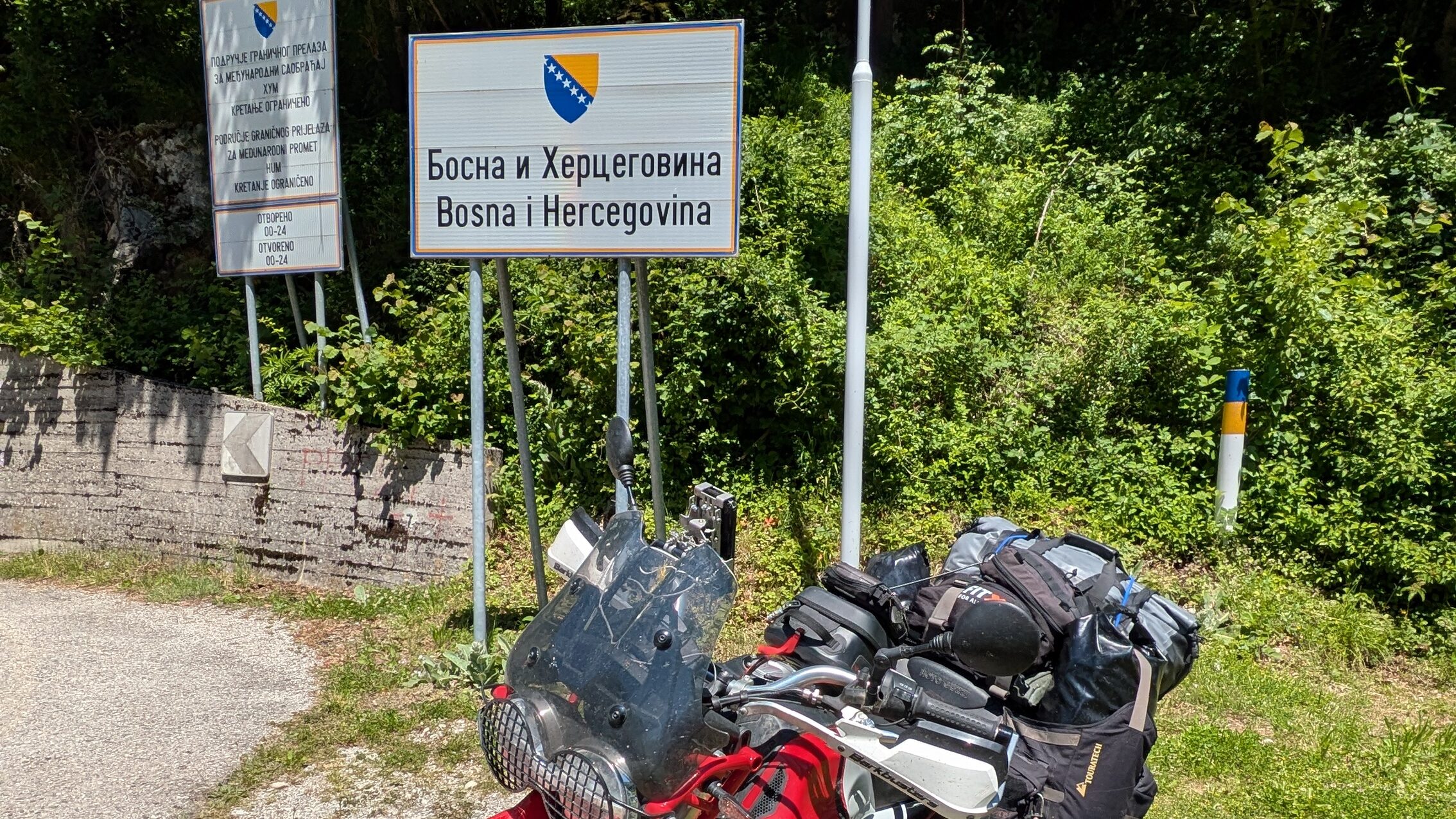 Balkan Motorcycle Route: Plan Your Best 2-Week Trip Motorcycle at border crossing between Balkan countries showing document check on the 2-week route