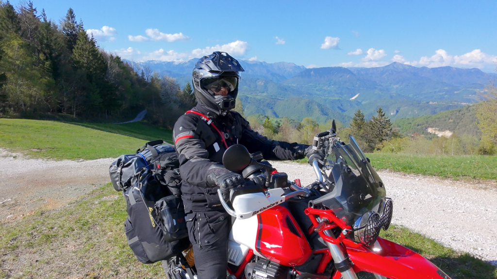 International Motorcycle Travel in Europe: Complete Guide Motorcycle rider on dramatic European road with vast landscape showing the rewards of international motorcycle travel in europe