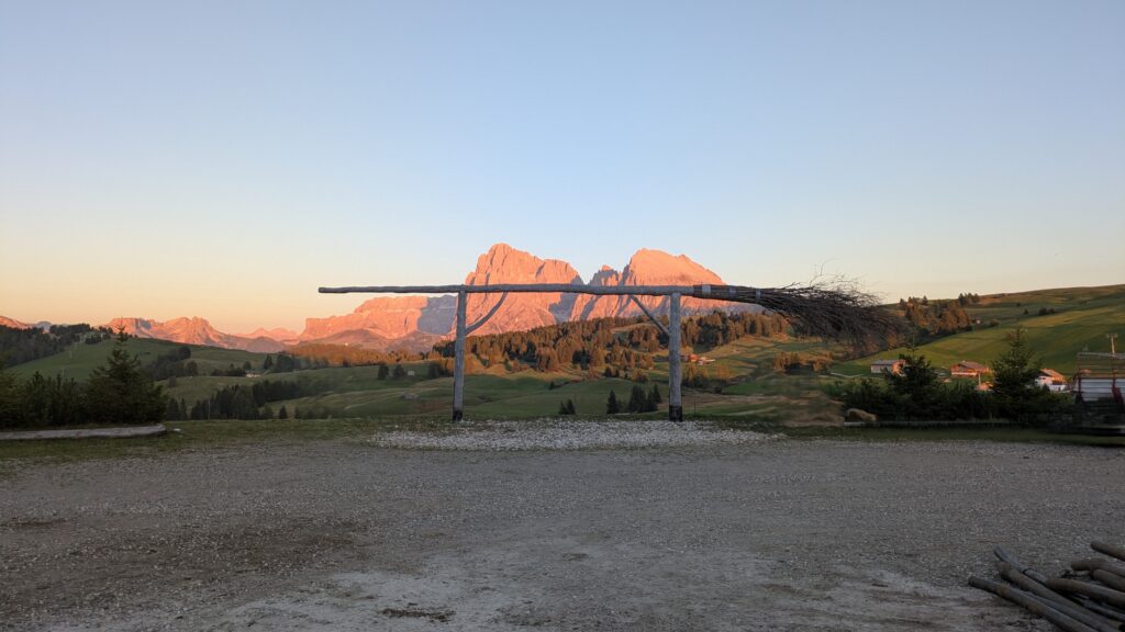 Northern Italy Motorcycle Routes: Dolomites and Alps Motorcycle on empty Dolomites pass road at golden hour with limestone peaks catching last light showing why northern italy motorcycle routes reward annual return visits