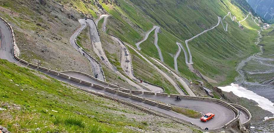 Northern Italy Motorcycle Routes: Dolomites and Alps stelvio pass 48 hairpins aerial motorcycle northern italy