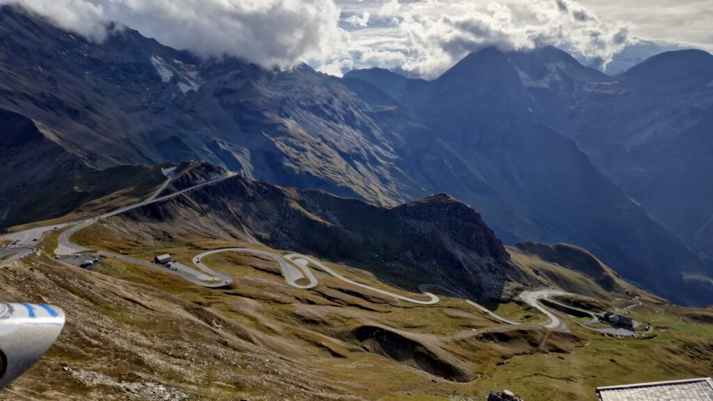 Motorcycle Weekend Trip: How to Plan a Short Tour Winding mountain road seen from above — every kilometre worth riding