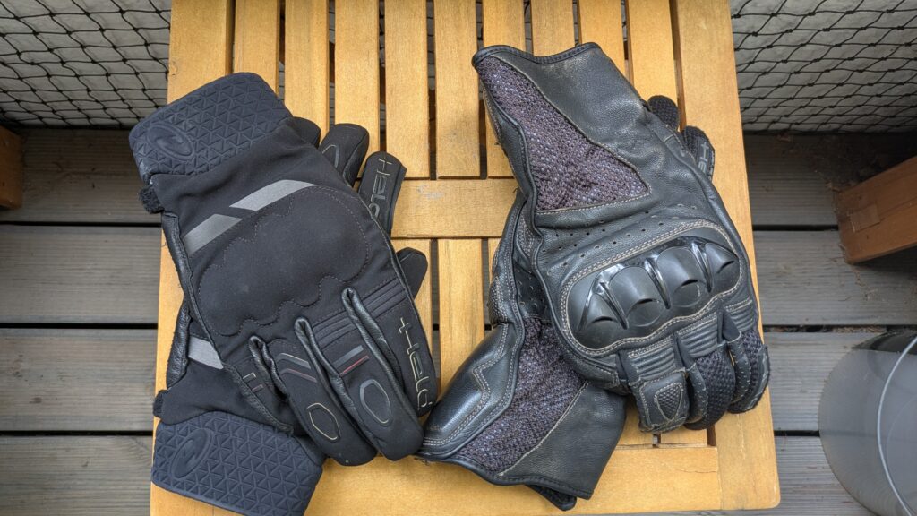 Motorcycle Riding Gear: The Complete Guide Waterproof and ventilated motorcycle glove pairs carried on a Balkans trip