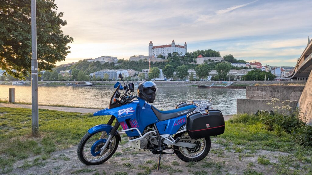 Slovakia Motorcycle Travel Guide: Routes and Top Tips Bratislava Castle and the UFO Tower bridge over the Danube at sunset